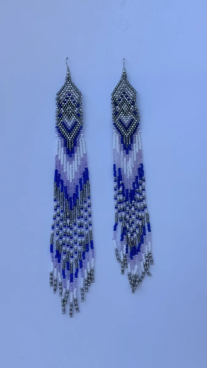 Pair of long beaded earrings in indigo, lilac, and silver fringe.