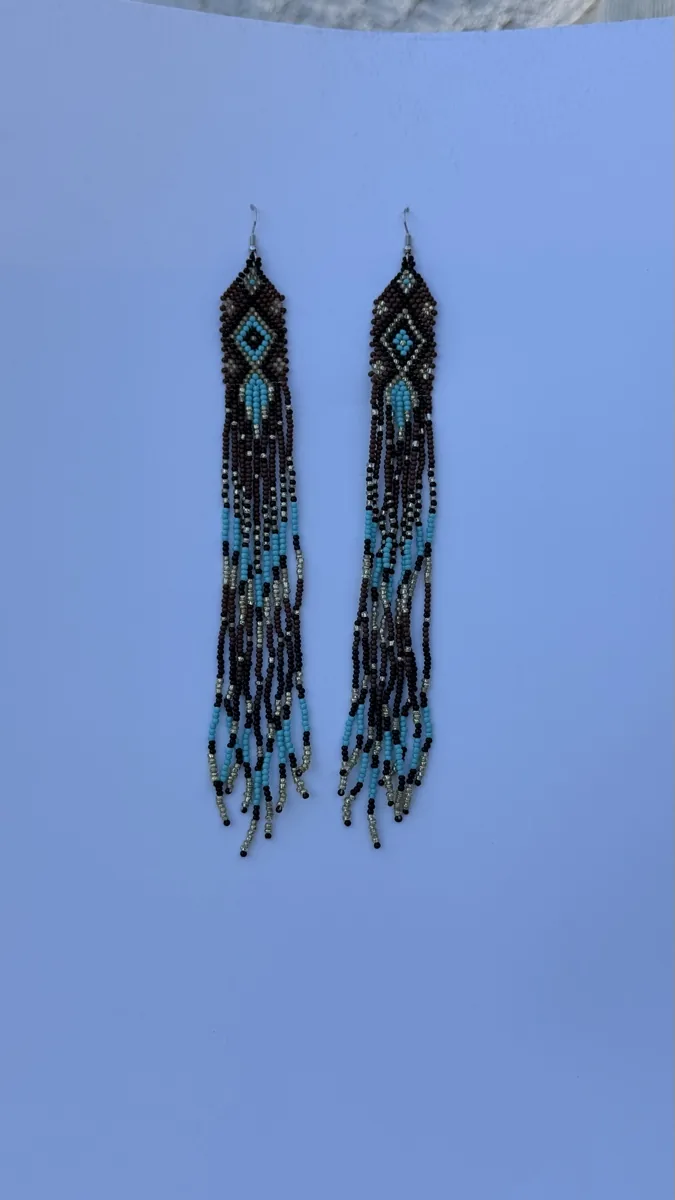 Long black and turquoise beaded fringe earrings with geometric tops.