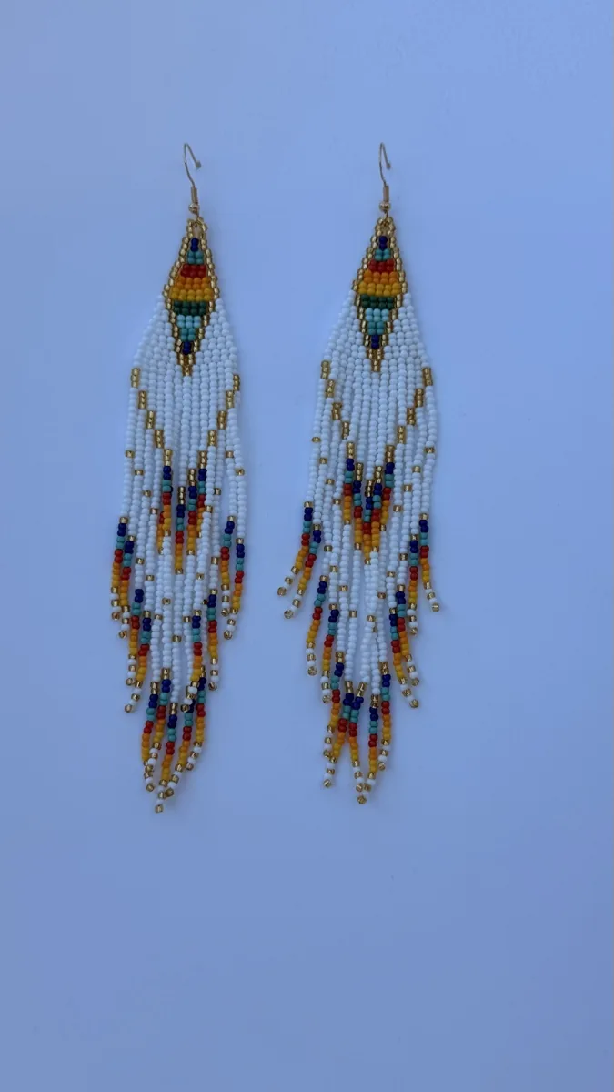 Pair of white and gold beaded triangle drop earrings with colorful fringe strands.