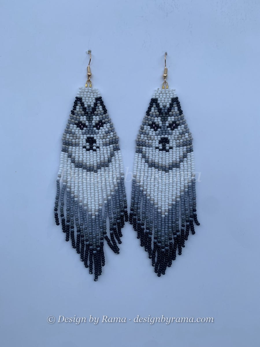 Long fringe earrings with beaded husky dog face panel in white and grey, ombre grey-to-black fringe below, wire hook.