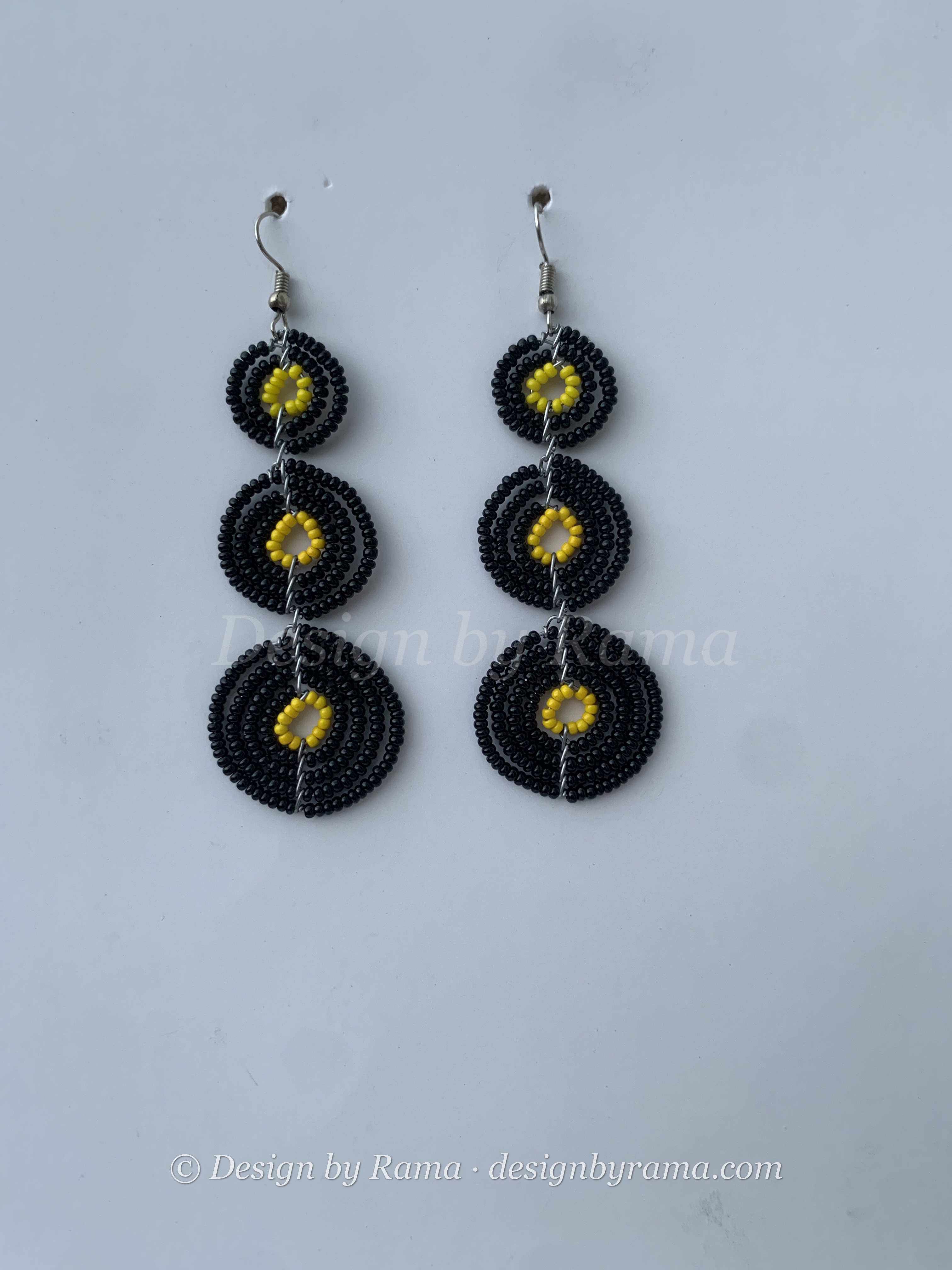 Donkorkrom Sun Discs — handmade black, gold beaded maasai earrings by Rama, Ghana, Duncan BC