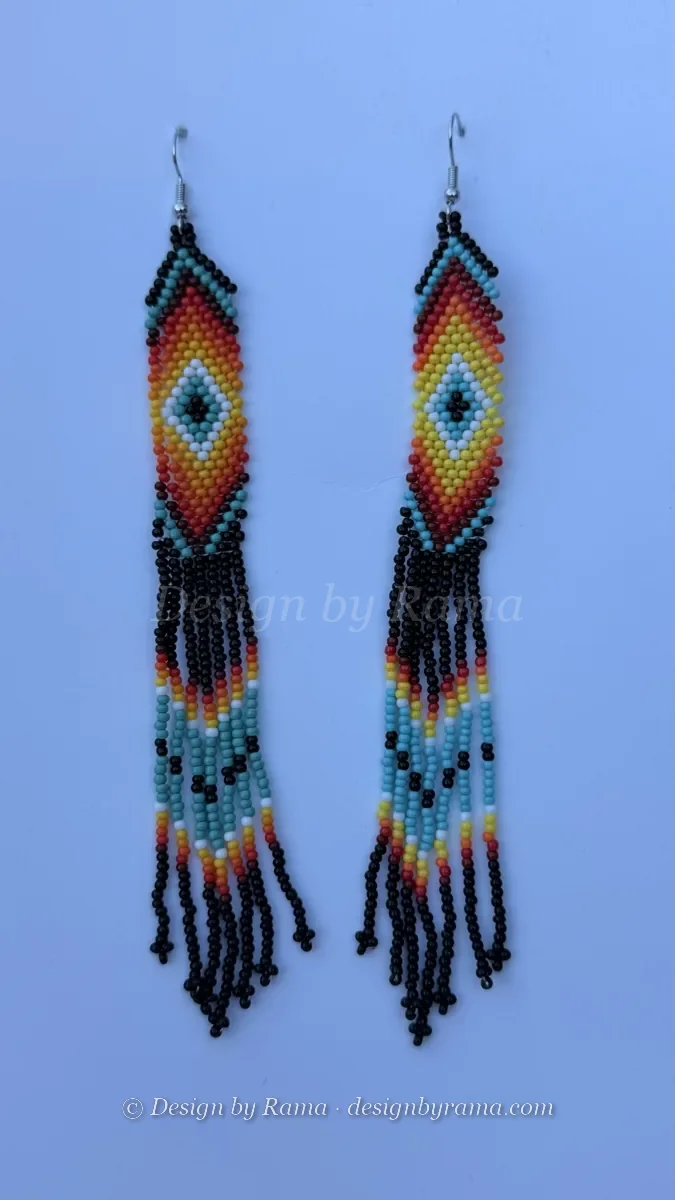 Pair of turquoise and black beaded drop earrings with colorful fringe.