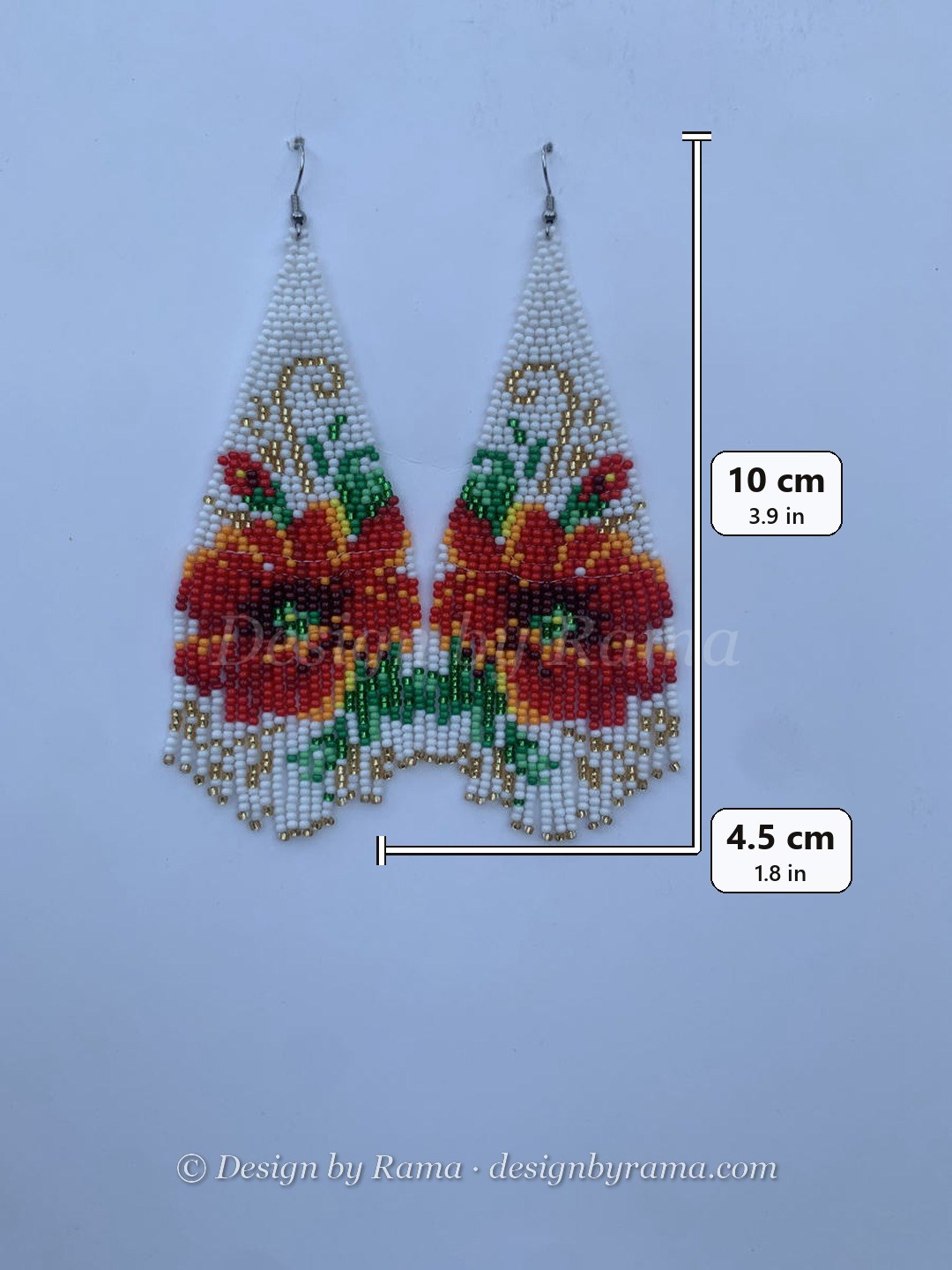 Long fringe earrings with large red flower on vine motif on white bead ground, scalloped fringe hem, wire hook.