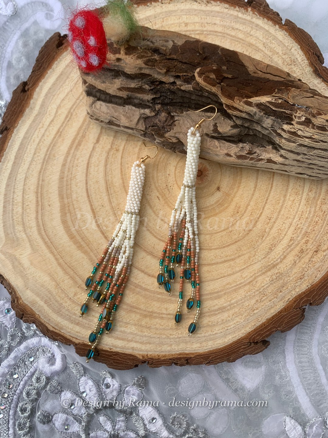 Sege Emerald Drop Fringe — handmade cream, white, emerald green, brown beaded long earrings by Rama, Ghana beads, Duncan BC